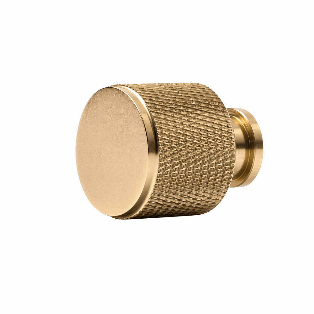 Skapsknapp Jirana i messing med ribbet kant, 22 mm